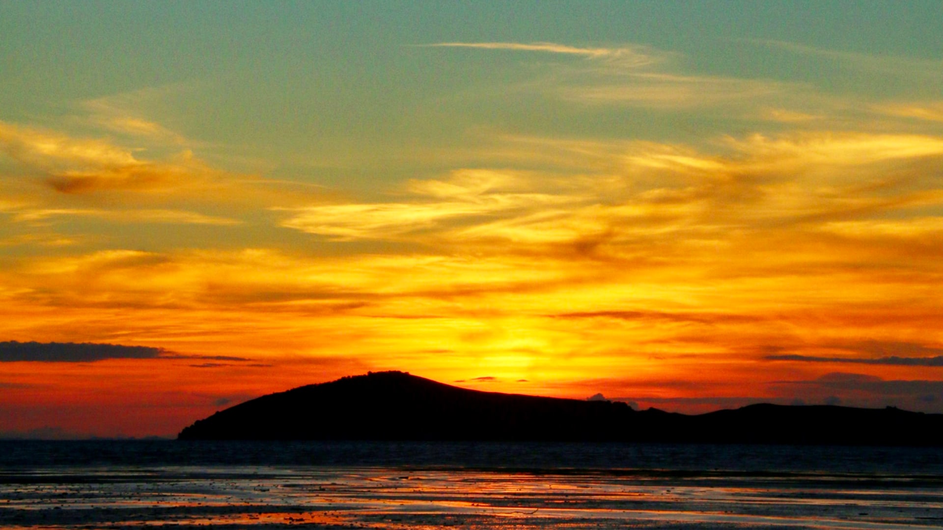 Golden hour over a shallow Texas coastal flat — a classic wade fishing spot